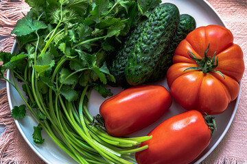 Organic garden tomatoes, cucumbers and herbs.Fresh vegetables.Top view.Full frame shot.