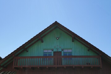 Cute turquoise alpine mountain hut with hunting trophies in Austrian Alps. Vorarlberg, Austria.