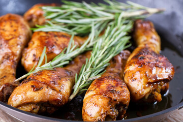 Fried Chicken Drumsticks with Herbs in a Pan