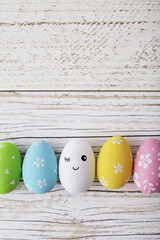 colorful easter eggs on wooden background