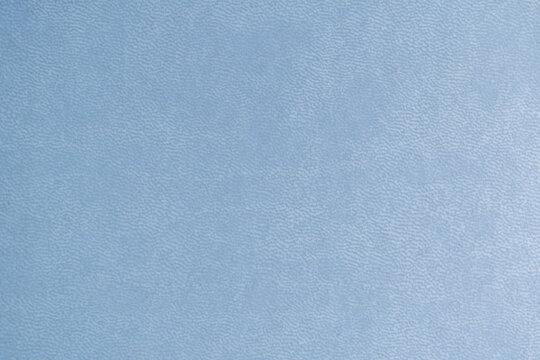 detalle de textura de cubierta de portada de agenda polipiel azul con detalles de impresión dorada
