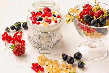Yogurt with chia seeds and fresh berries. Healthy food rich in omega, fiber, vitamins, antioxidants.