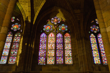 Fototapeta na wymiar Old stone cathedral with beautiful rose windows.