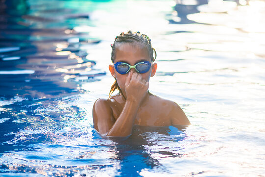 Portrait of a little swimer at the pool