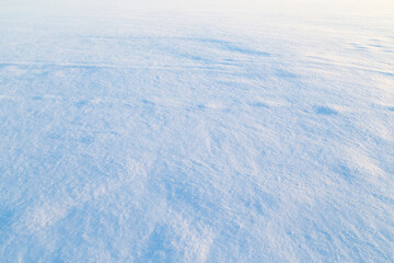 Close-up of fresh shiny snow on the ground on a sunny day. Good as a winter season background.