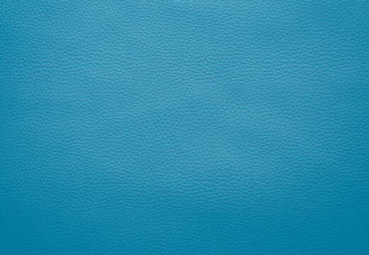 Close-up of detailed turquoise or light blue faux leather surface. High resolution full frame textured background.
