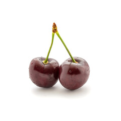 Photo of red cherry with tail and water drops isolated on white background