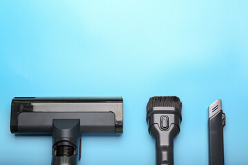 Vacuum cleaner on  blue background. Top view. Cleaning concept.