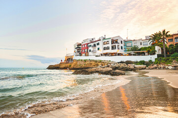 Beautiful white houses, mediterranean sea and a clear blue sky in the setting sun and sunset in El...