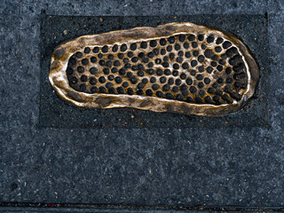 Footprint of a Roman legionnaire's sandal on a street of León, Spain. 