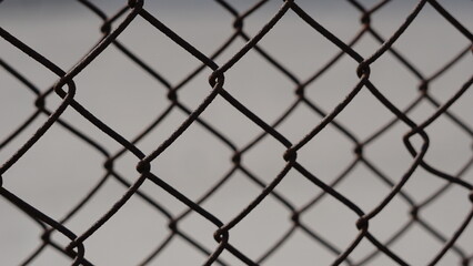 close-up of oxidized wire mesh fence