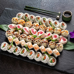 tasty sushi on the black stone