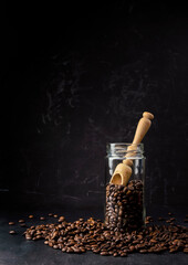 coffee on a dark background.Coffee time. Coffee break. Coffee in a clear glass. Jar with coffee beans. Grains of coffee