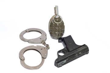Obraz premium weapons, handcuffs, pistol, grenade on a white background