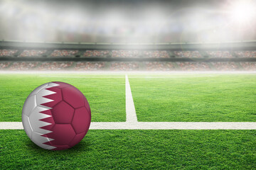Football With Qatar Flag in Soccer Stadium With Copy Space.