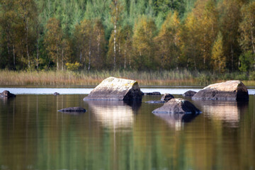 Naklejka premium Stones in lake