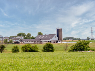 Amish farm and silos in the countriside of Lancaster, Pennsylvania.