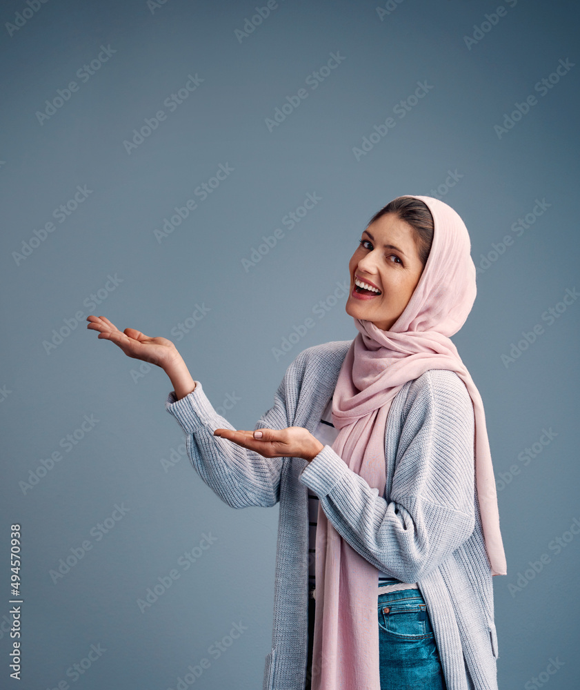 Canvas Prints This is my product of choice. Cropped portrait of an attractive young woman endorsing your product while standing against a grey background.