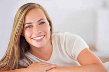 Naklejka premium Spending the day at home. Portrait of an attractive young woman relaxing at home.
