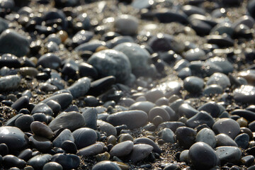Sea pebbles. Small stones texture. Color stone in abstract background.
