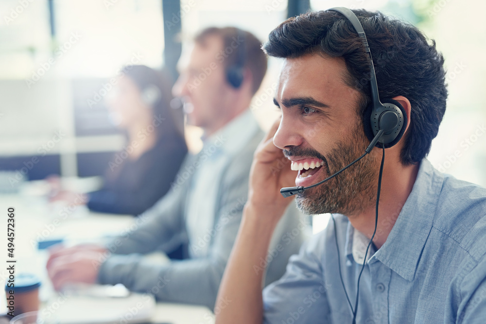 Poster ive got just the solution for you. cropped shot of a call centre agent working in an office with his