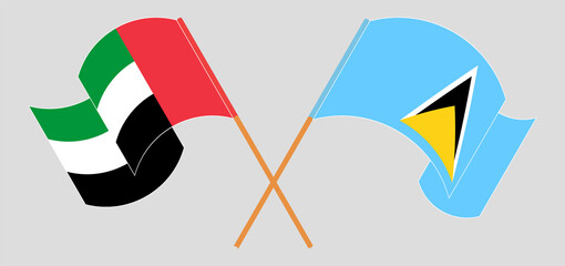 Crossed flags of the United Arab Emirates and Saint Lucia. Official colors. Correct proportion