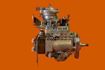 Reconditioned diesel car high pressure pump on a white background. Automotive diesel pump, mechanical, from older type car. View of pump from side.