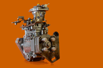 Reconditioned diesel car high pressure pump on a white background. Automotive diesel pump, mechanical, from older type car. View of pump from port side.