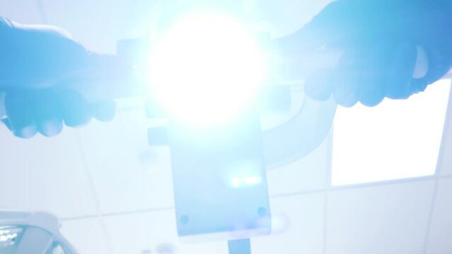 Dentist lamp. dental microscope with lamp. Light when moving the device.