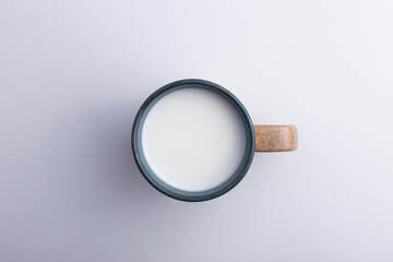 a cup of milk top view on a white background