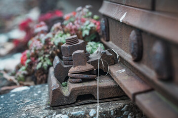 An old overgrown rail line leading into abandoned freight station in Prague