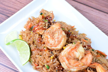 Sauteed wok rice, accompanied by beef tenderloin, vegetables, chicken, sesame, soy sauce and teriyaki