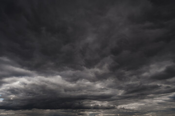 Fototapeta na wymiar background of dark dramatic sky with stormy clouds before rain or snow, extreme weather