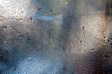 Fototapeta na wymiar Water drops on metal surface