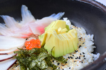 Japanese sashimi, rice, sesame, raw salmon, caviar and avocado