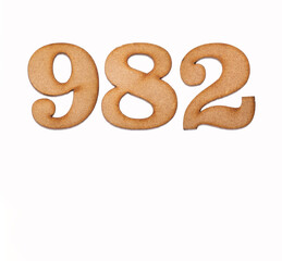 Number 982 in wood, isolated on white background