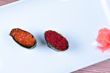 traditional japanese food, very colorful on white plate and sauce
