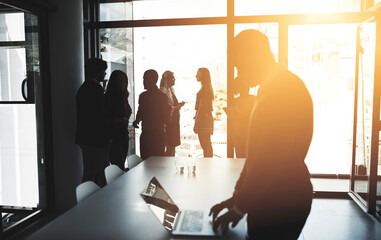 In this office, they all aim for one thing - excellence. Cropped shot of businesspeople in an office.