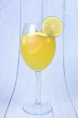 Refreshing orange drink, lemon and mint leaves