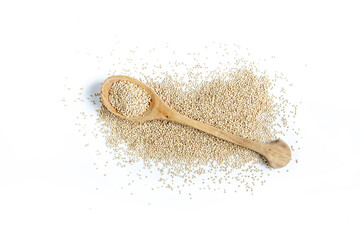 Whole grain quinoa on a white background, accompanied by a wooden spoon.