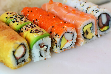 Traditional colorful suhi, cream cheese, salmon, caviar, rool sishi crunch, sesame seeds and sauce © KreaFoto