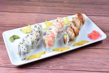 Traditional colorful suhi, cream cheese, salmon, caviar, rool sishi crunch, sesame seeds and sauce