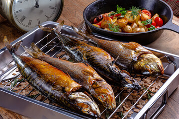 Smoked fish on the grill is on the table