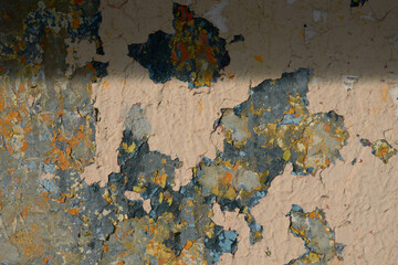 The texture of the multilayer old painted wall.