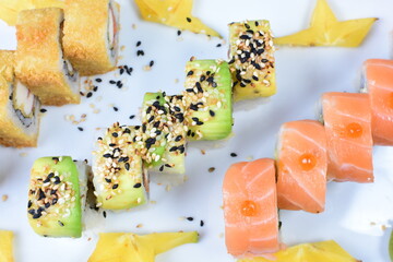 Traditional colorful suhi, cream cheese, salmon, caviar, rool sishi crunch, sesame seeds and sauce