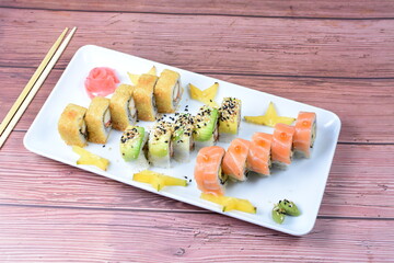 Traditional colorful suhi, cream cheese, salmon, caviar, rool sishi crunch, sesame seeds and sauce