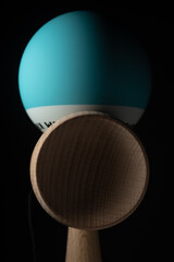 Kendama is a traditional Japanese skill toy. It consists of a handle (ken), a pair of cups (sarado), and a ball (tama) that are all connected together by a string
