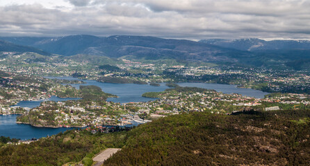 Naklejka na ściany i meble View from the plane on the city of Bergen and its surroundings with mountains and sea