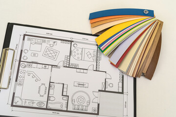 house blueprint with wooden vinyl sampler on desk
