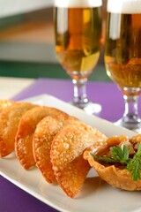 Pastries with pepper sauce